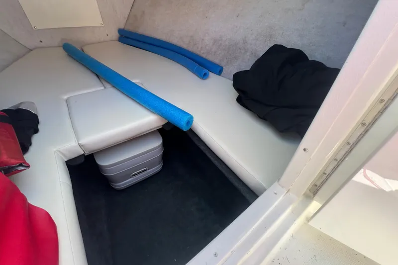 Slide: The Image of Interior cabin of 1999 Wellcraft 302 Scarab Sport boat with seating and storage. - 56