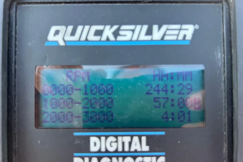 Slide: The Image of Digital diagnostic display showing RPM hours for Wellcraft 302 Scarab Sport, 1999 model. - 68