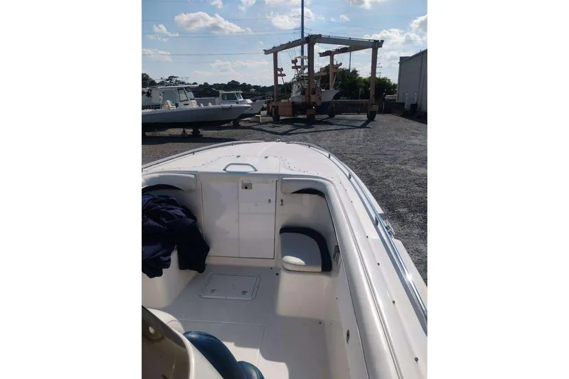 Slide: The Image of Twin Mercury outboard engines on a 1999 Wellcraft Scarab 302 Sport boat. - 7