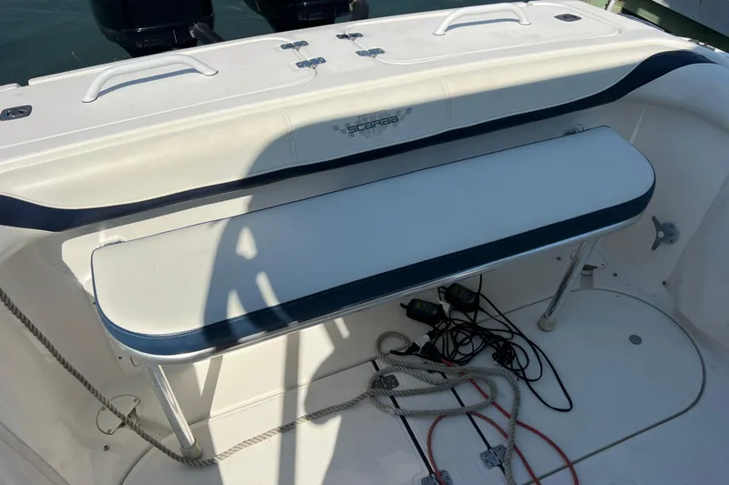 Slide: The Image of 1999 Wellcraft 302 Scarab Sport boat interior with seating and equipment. - 74