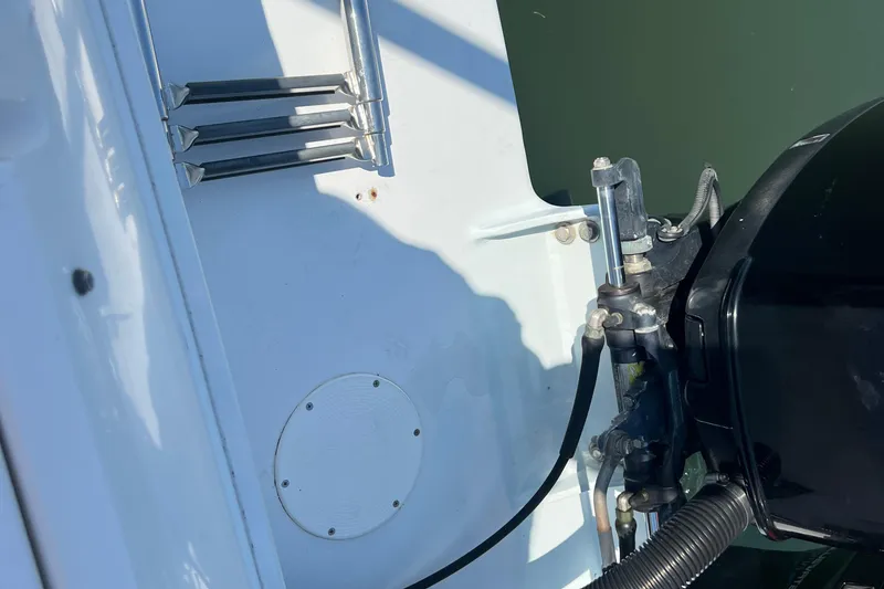 Slide: The Image of 1999 Wellcraft 302 Scarab Sport boat engine and ladder detail. - 76