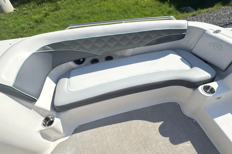 Slide: The Image of Luxurious seating on 2022 Splendor 239 Sunstar boat, featuring elegant design and cup holders. - 18