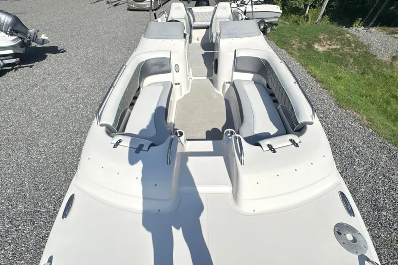 Slide: The Image of 2022 Splendor 239 Sunstar boat with spacious seating on gravel lot. - 21
