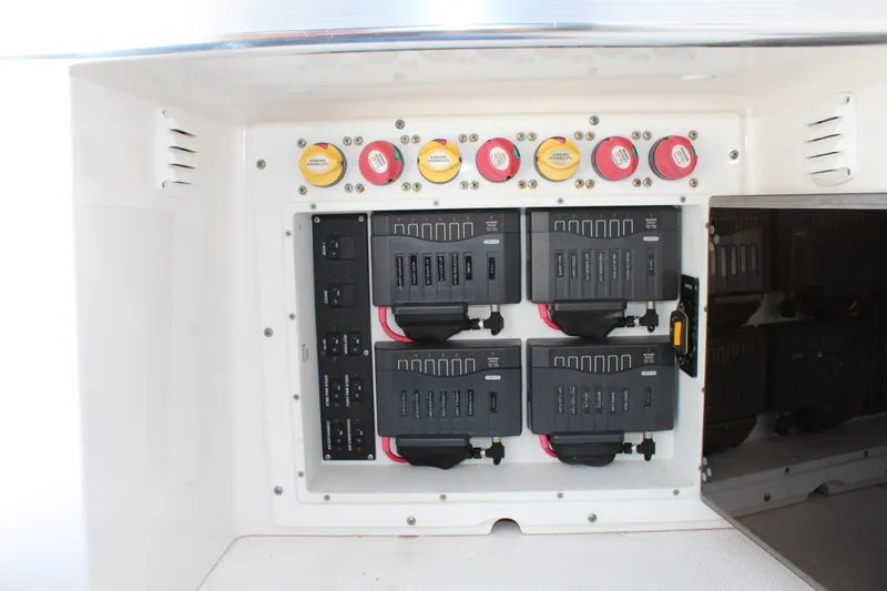 Slide: The Image of Electrical panel of 2016 Edgewater 370CC boat with circuit breakers and switches. - 11