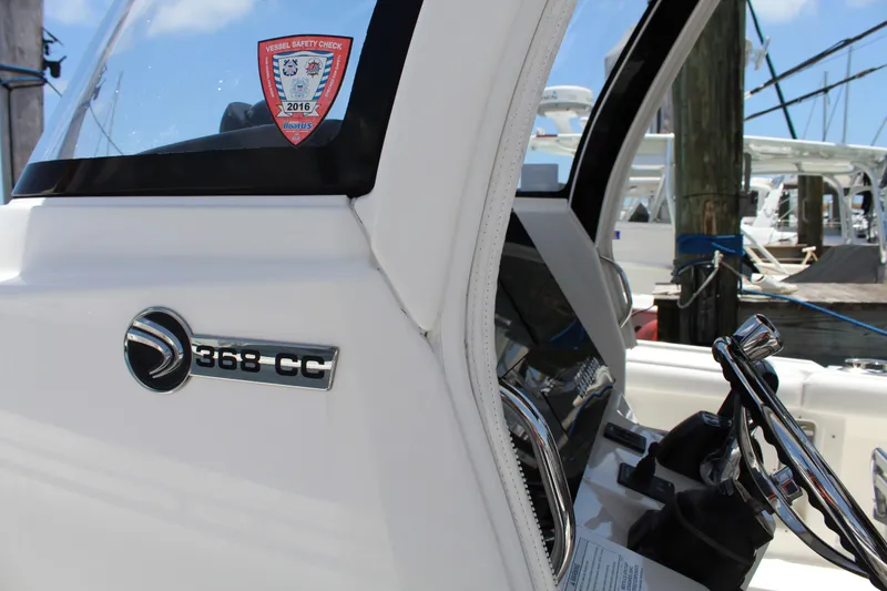 Slide: The Image of Edgewater 370CC boat interior with 2016 vessel safety check sticker. - 13