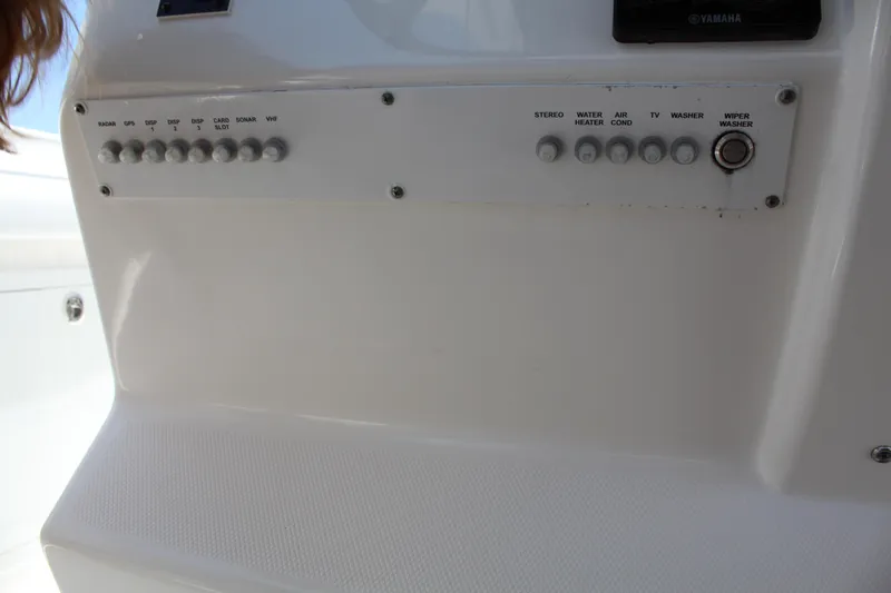 Slide: The Image of Control panel of a 2016 Edgewater 370CC boat with labeled switches. - 15