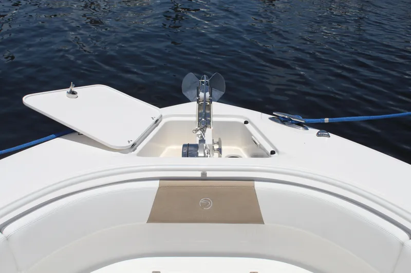 Slide: The Image of Bow of 2016 Edgewater 370CC boat with anchor and open hatch on calm water. - 31