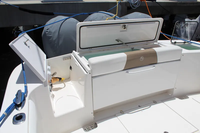 Slide: The Image of 2016 Edgewater 370CC boat with open storage compartments and seating area. - 37