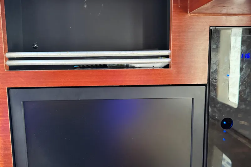 Slide: The Image of Interior of 2016 Edgewater 370CC boat with wooden paneling and electronic display. - 45