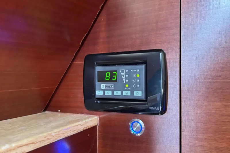 Slide: The Image of Digital control panel on 2016 Edgewater 370CC boat, displaying temperature settings. - 49