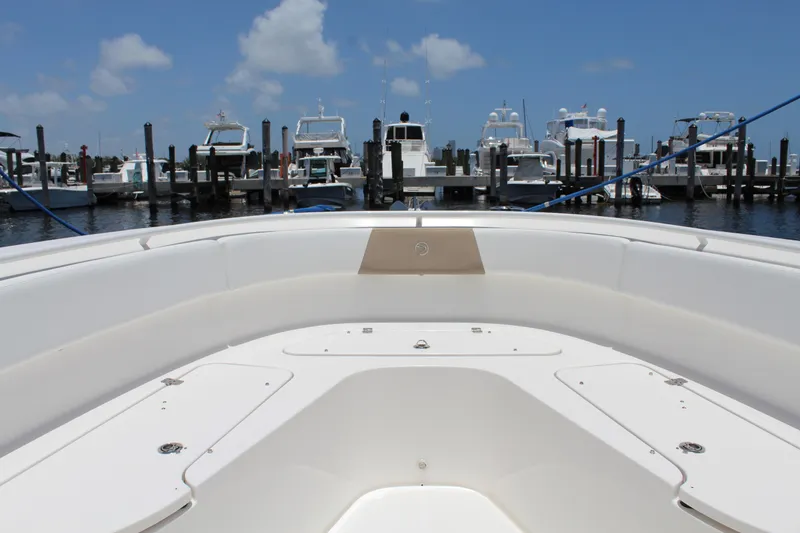 Slide: The Image of Bow view of 2016 Edgewater 370CC boat docked at marina under blue sky. - 8