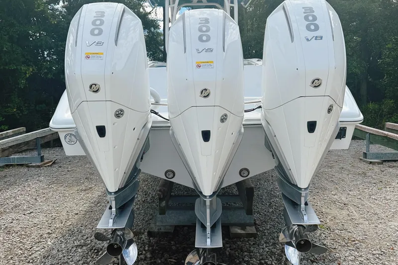 Slide: The Image of 2024 Yellowfin 36 Offshore boat with triple 300 V8 engines, rear view. - 2