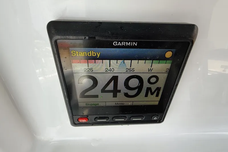 Slide: The Image of Garmin display on 2024 Yellowfin 36 Offshore showing 249° heading in standby mode. - 25