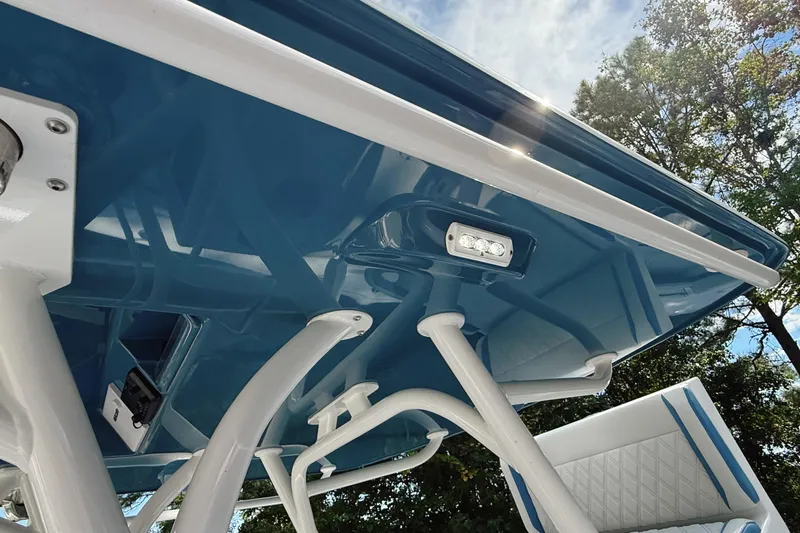 Slide: The Image of 2024 Yellowfin 36 Offshore boat canopy with blue finish and integrated lighting. - 31