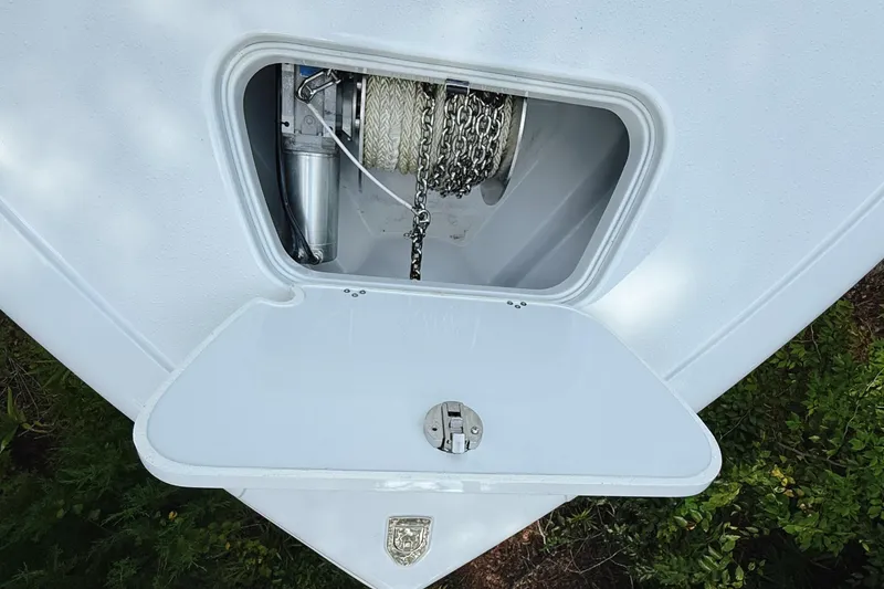Slide: The Image of Anchor compartment of 2024 Yellowfin 36 Offshore boat, featuring chain and rope storage. - 37