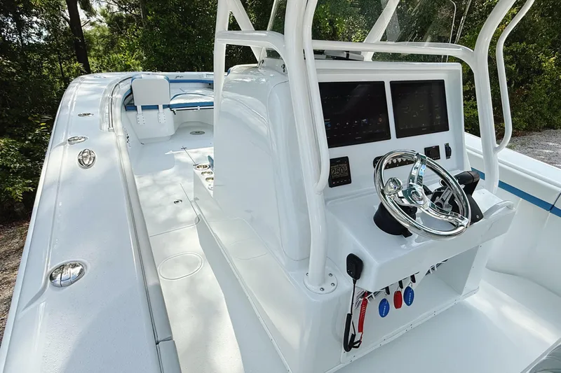 Slide: The Image of 2024 Yellowfin 36 Offshore boat cockpit with modern controls and sleek design. - 6