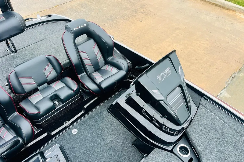 Slide: The Image of 2021 Nitro Z19 Pro boat interior with sleek black and red seating design. - 26