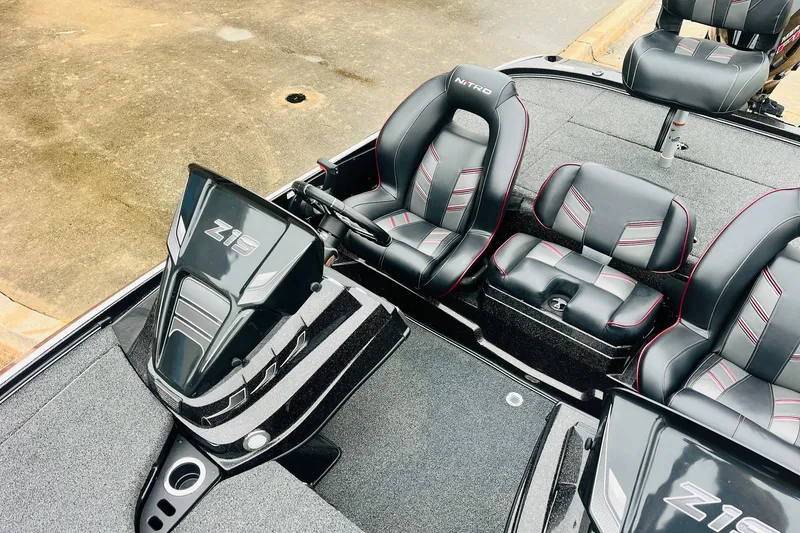 Slide: The Image of 2021 Nitro Z19 Pro boat interior with sleek black and red seating. - 27