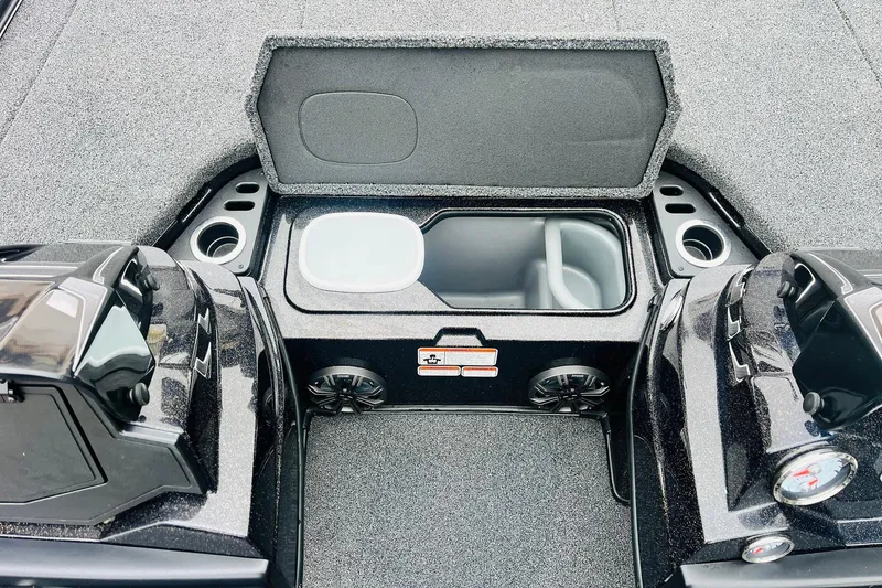 Slide: The Image of 2021 Nitro Z19 Pro boat interior with open storage compartment and cup holders. - 29