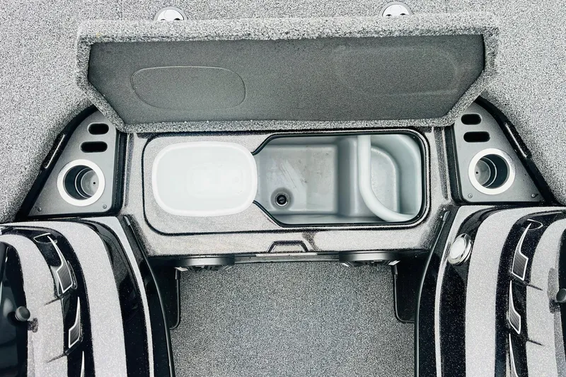 Slide: The Image of 2021 Nitro Z19 Pro boat storage compartment with open lid and cup holders. - 30