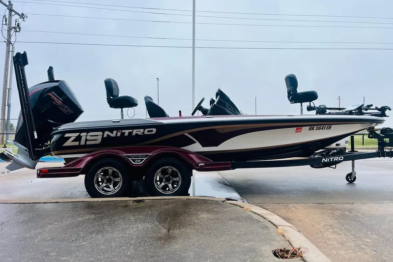 Slide: The Image of 2021 Nitro Z19 Pro boat on trailer, side view, parked outdoors. - 4