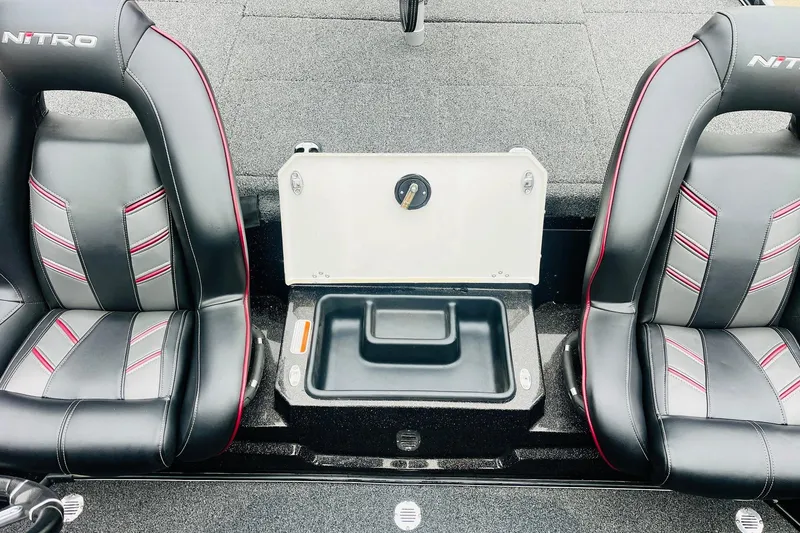 Slide: The Image of 2021 Nitro Z19 Pro boat interior with black and red seats and storage compartment. - 42