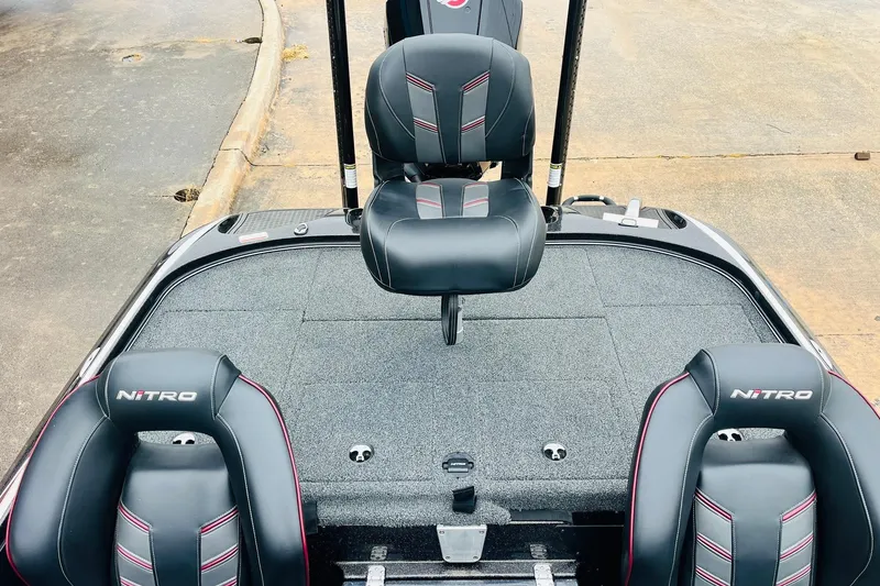Slide: The Image of 2021 Nitro Z19 Pro boat interior with black and red seats on a gray deck. - 43