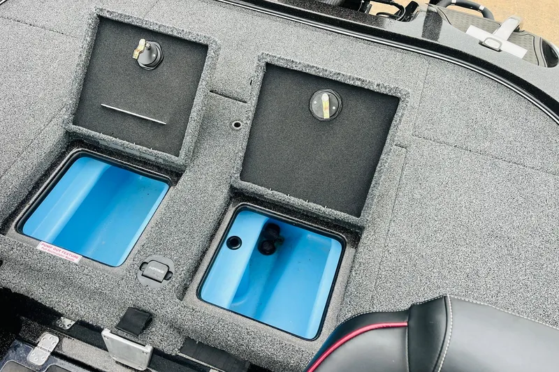 Slide: The Image of Nitro Z19 Pro 2021 boat storage compartments with blue interior and carpeted lids. - 47