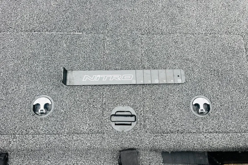Slide: The Image of 2021 Nitro Z19 Pro boat deck with measurement tool and storage latches. - 48