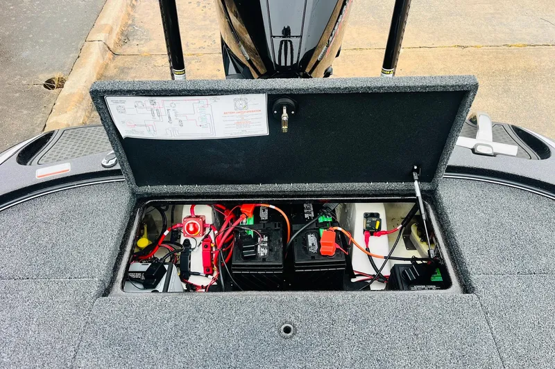 Slide: The Image of Open battery compartment of 2021 Nitro Z19 Pro boat, showing wiring and components. - 54