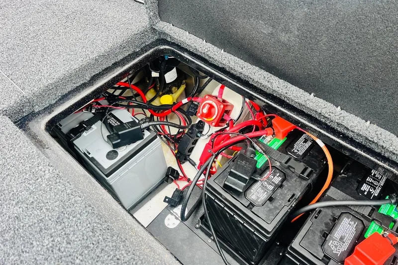 Slide: The Image of Battery compartment of 2021 Nitro Z19 Pro boat with wiring and components. - 55