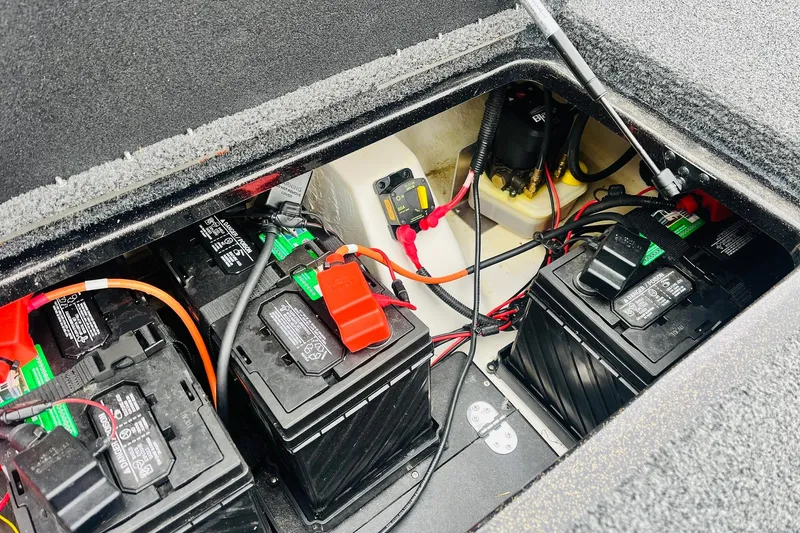 Slide: The Image of Battery compartment of a 2021 Nitro Z19 Pro boat, showing multiple batteries and wiring. - 56
