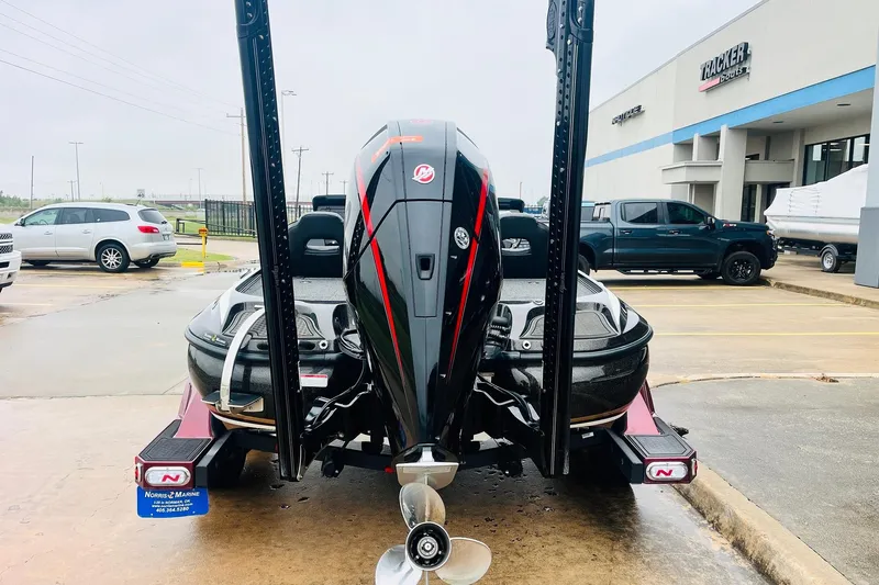 Slide: The Image of 2021 Nitro Z19 Pro boat with powerful outboard motor at dealership parking lot. - 6