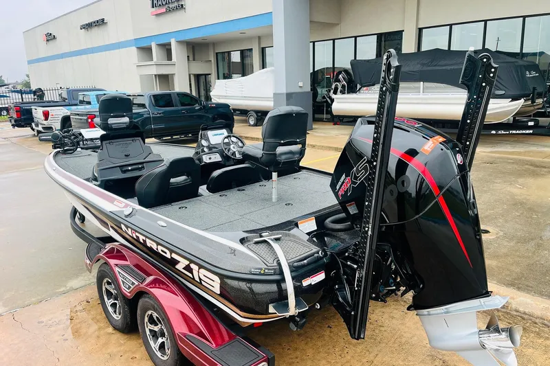 Slide: The Image of 2021 Nitro Z19 Pro boat with powerful engine, parked outside dealership. - 7
