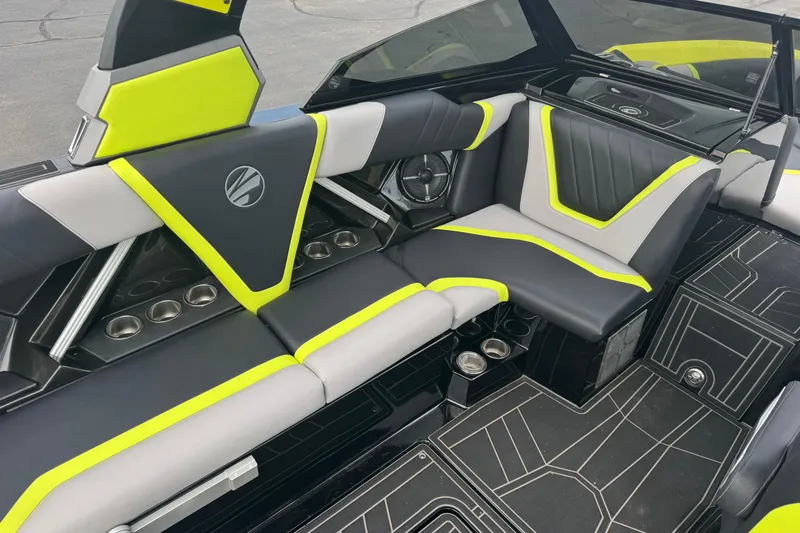 Slide: The Image of 2020 Tigé 23RZX boat covered and docked in a marina. - 14