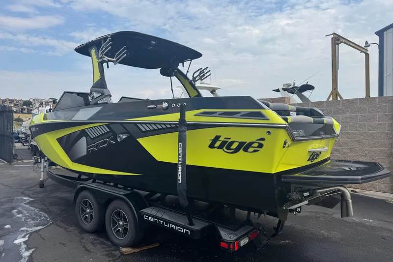 Slide: The Image of 2020 Tigé 23RZX boat interior with modern black and lime green seating design. - 6