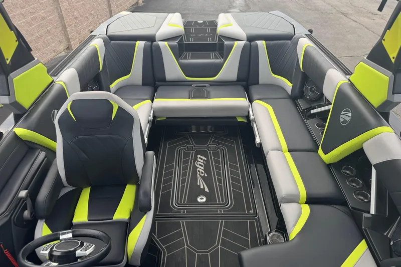 Slide: The Image of 2020 Tigé 23RZX boat interior with modern design, featuring black and neon accents. - 8