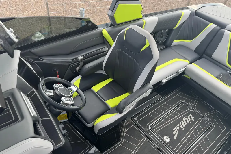 Slide: The Image of 2020 Tigé 23RZX boat interior with modern seating and vibrant accents. - 9