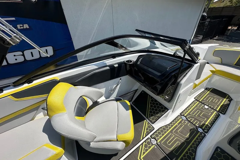 Slide: The Image of 2023 Scarab 215 ID boat interior with modern seating and stylish design. - 12