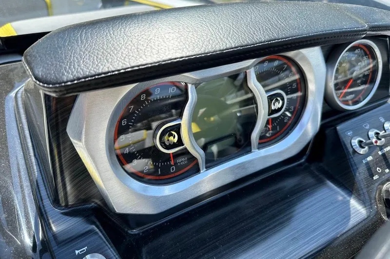 Slide: The Image of 2023 Scarab 215 ID dashboard with sleek gauges and modern design. - 16