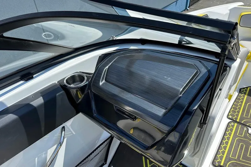Slide: The Image of 2023 Scarab 215 ID boat interior with sleek dashboard and cup holder. - 19