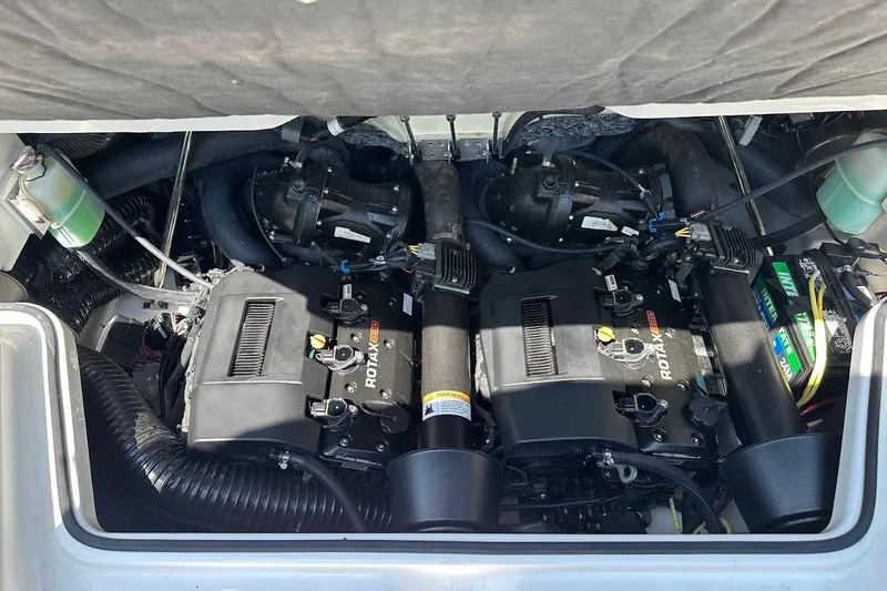 Slide: The Image of Engine compartment of 2023 Scarab 215 ID boat with Rotax engines. - 28