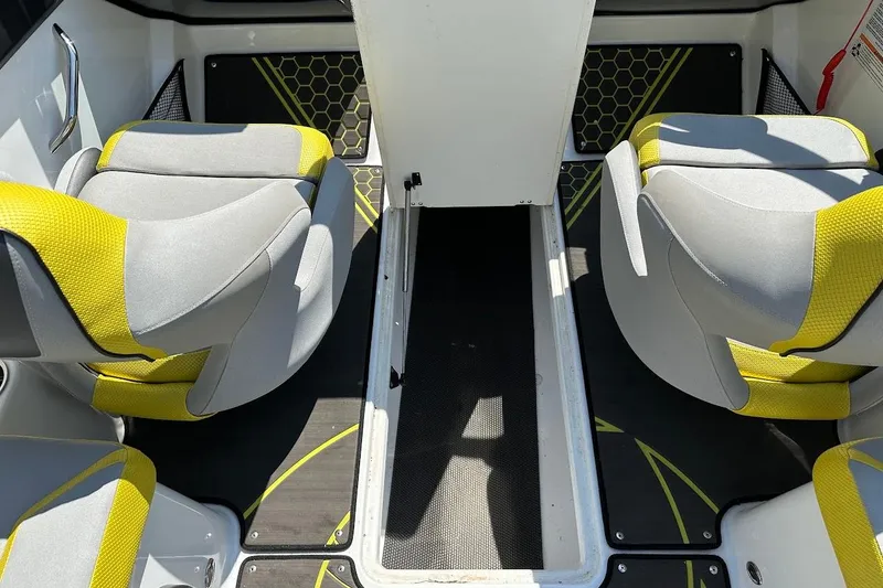 Slide: The Image of 2023 Scarab 215 ID boat interior with yellow and gray seating, modern design. - 32