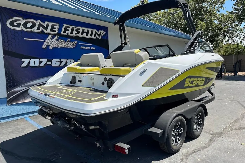 Slide: The Image of 2023 Scarab 215 ID boat on trailer at Gone Fishin' Marine dealership. - 6