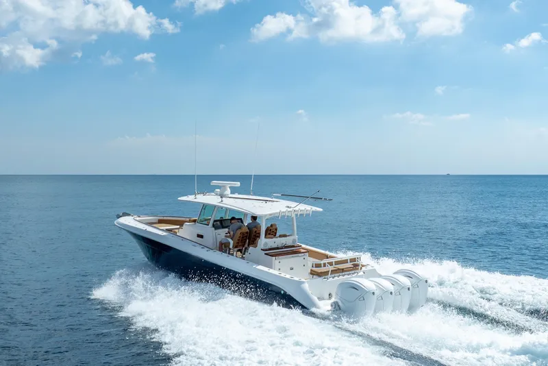 The Image of 2020 HCB 42 Lujo boat cruising on open sea under clear blue sky. - 0