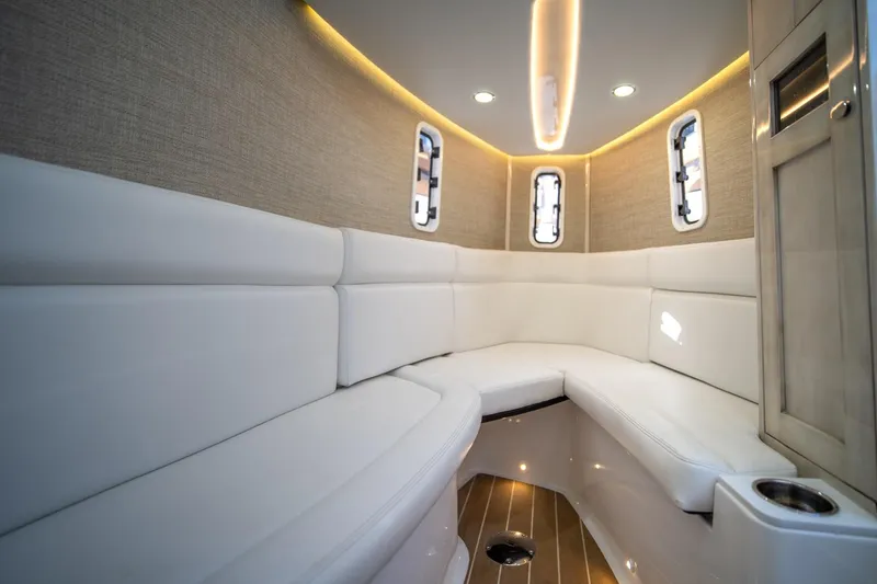 Slide: The Image of Luxurious interior of 2020 HCB 42 Lujo boat with white seating and ambient lighting. - 10