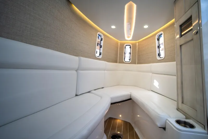 Slide: The Image of Interior of 2020 HCB 42 Lujo boat with white seating and modern lighting. - 11