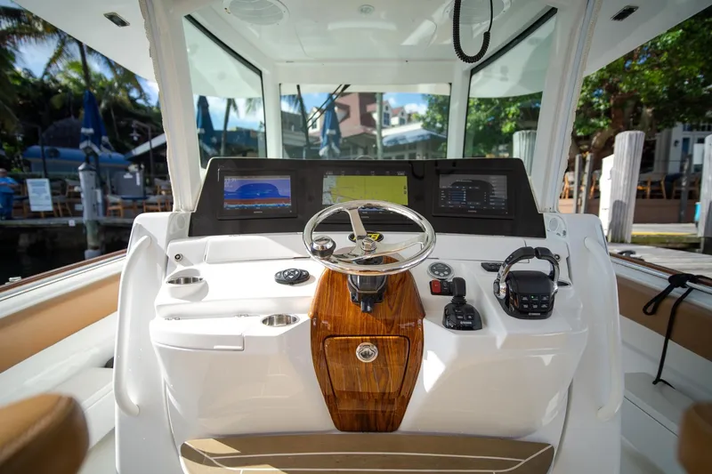 Slide: The Image of Helm of 2020 HCB 42 Lujo boat with modern navigation equipment and controls. - 8