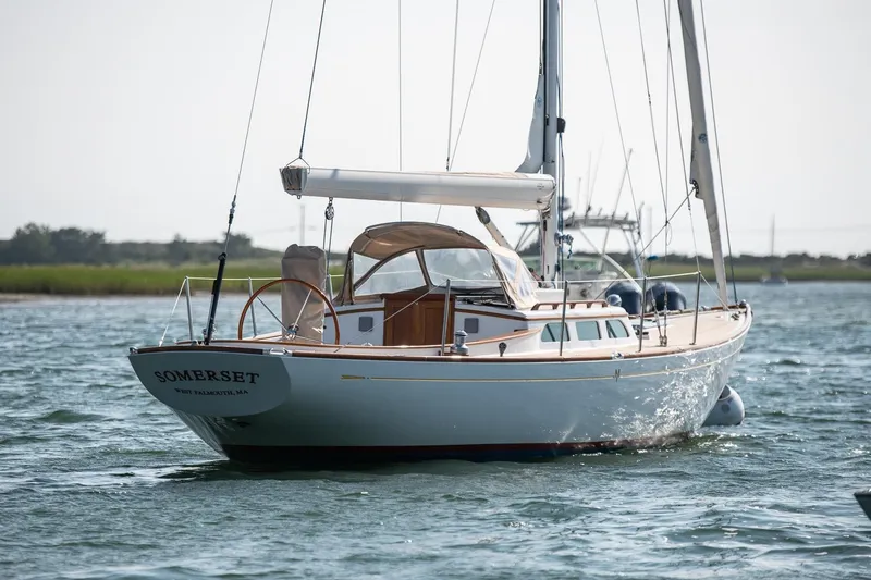 Slide: The Image of 2006 Morris M36 Daysailer on water, named Somerset, with scenic background. - 1