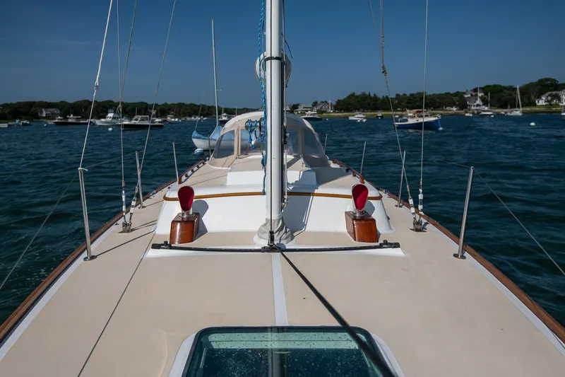 Slide: The Image of 2006 Morris M36 Daysailer on calm waters, showcasing deck and mast. - 18